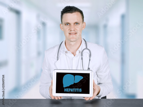 American male doctor showing hepatitis word