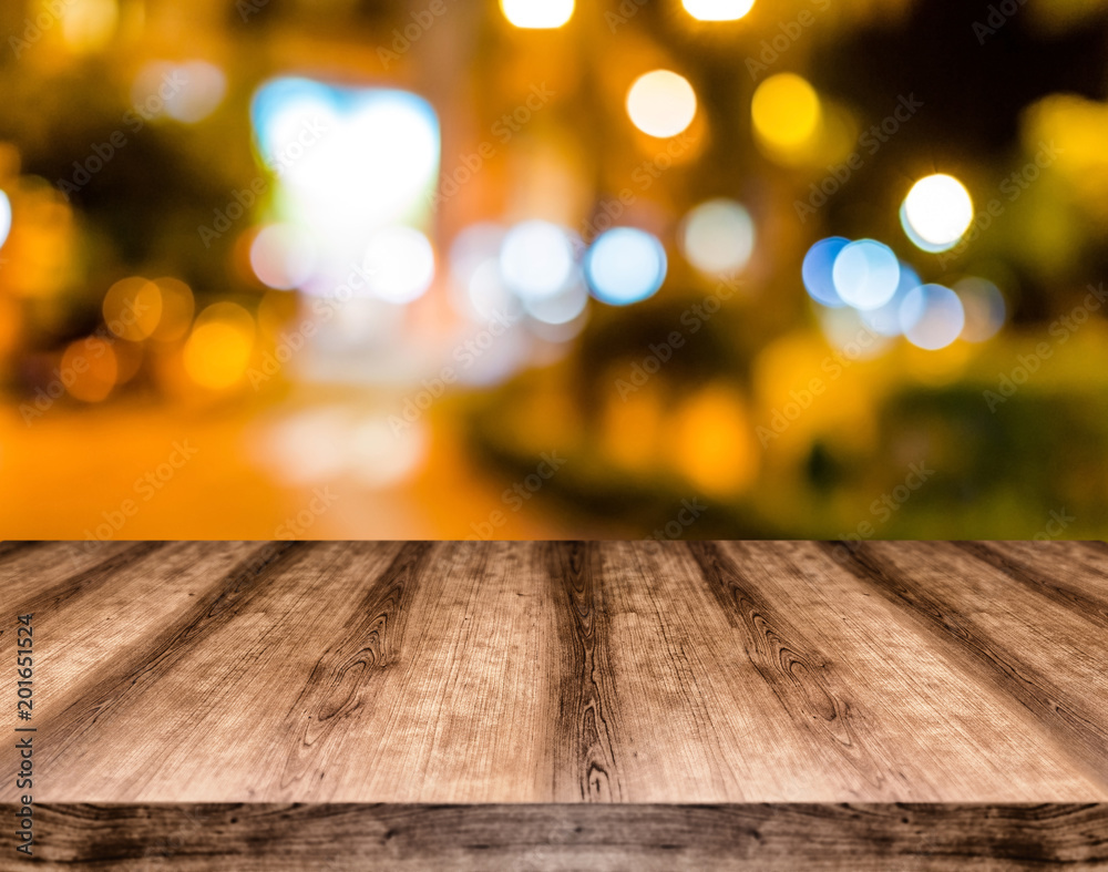 Wooden empty table board in front of blurred background. Can be used for display or montage any product. Mock up for display your product.