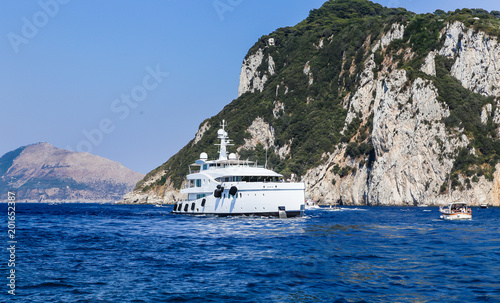 The sea yacht comes into port  Marina Grande.  Capri island, Italy © Nikolai Korzhov