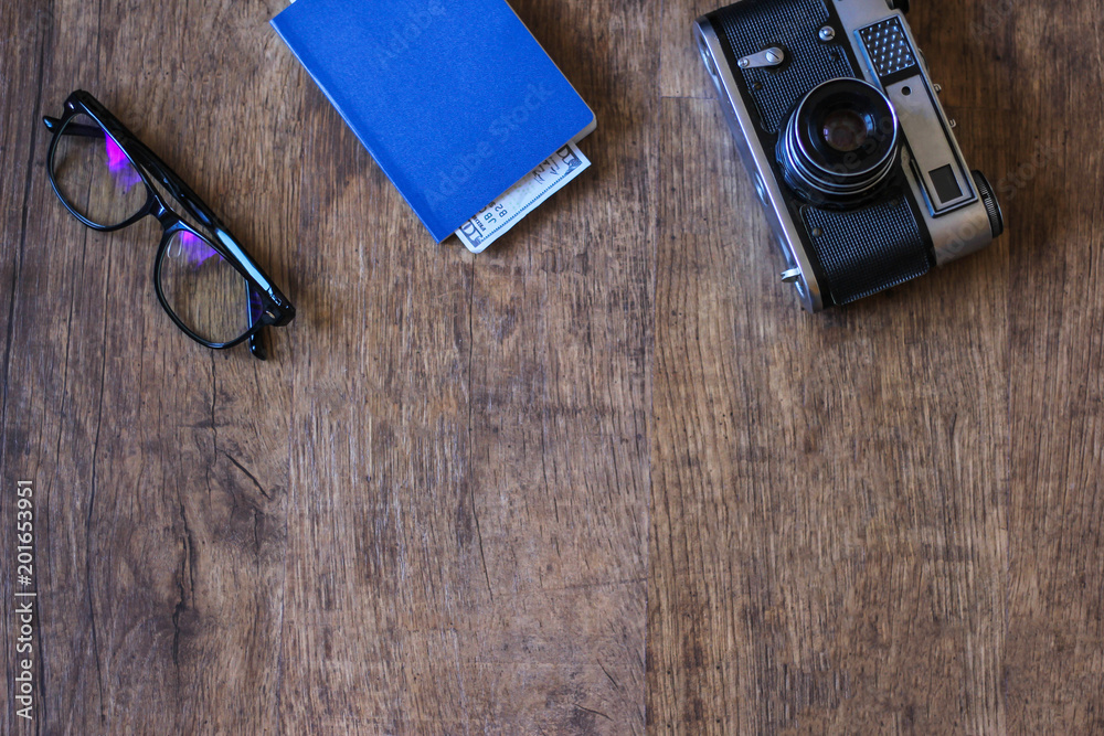 Flat lay design of work desk with notebook, glasses, camera on white background. Flat lay design of work desk with notebook, glasses, camera on white background.