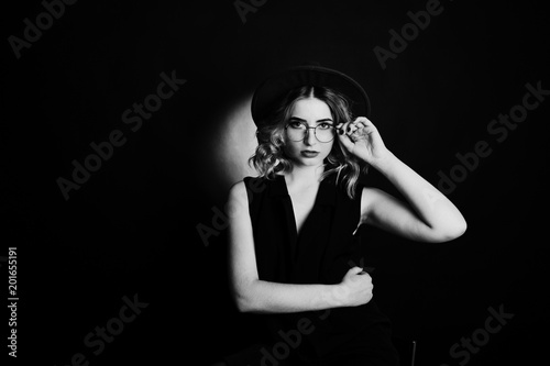 Wallpaper Mural Studio portrait of blonde girl in black wear, red hat and glasses against dark background. Torontodigital.ca
