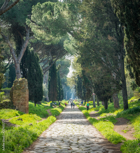 The ancient Appian Way (Appia Antica) on a sunny spring morning, in Rome. photo