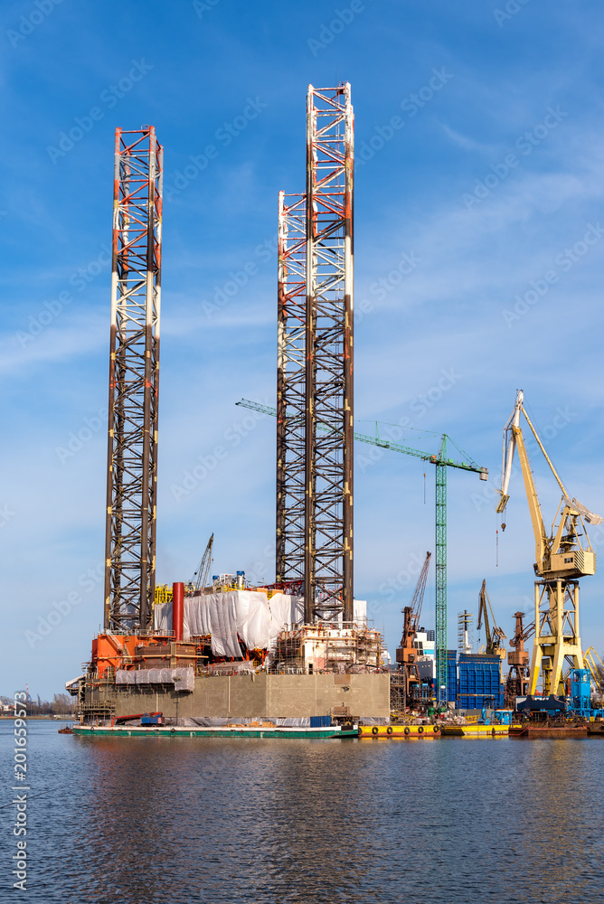 Obraz premium Oil rig docked in shipyard of Gdansk. Poland