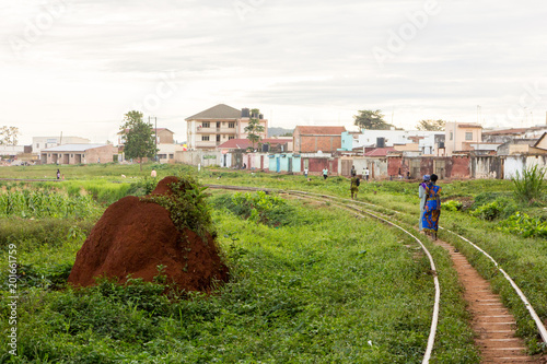 Lugazi, Uganda. 17 May 2017. A railway track in rural Uganda. A termite mound near it. photo