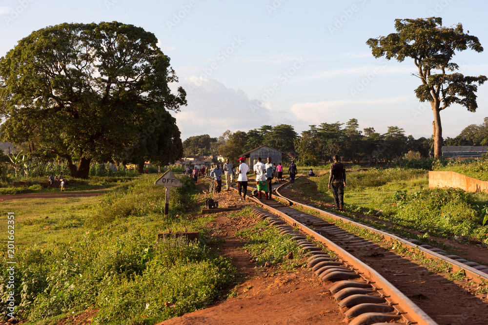 Lugazi, Uganda. 1 May 2017. A railway track in rural Uganda. People are walking along and across it.