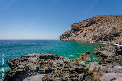 Sunny beautiful summer coast view to the greek blue sea with shallow clear water and small volcano rocks at empty shore escape relax swim, Avlaki Beach, Nisyros Island, Kos, Dodecanese, Greece © Thomas Jastram