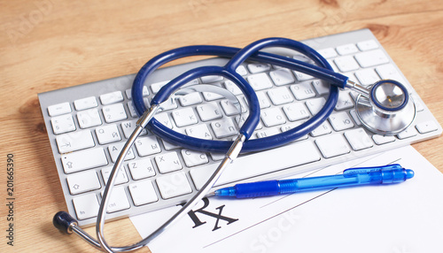 Close up of stethoscope on pc keyboard. Healthcare concept photo