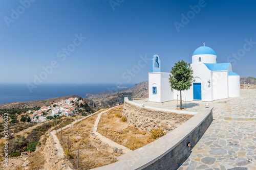 Holy greek white blue chruch chapel of agios theologos sant john shining above the village Nikia over the greek sea on the edge of a volcano on the island of Nisyros, Kos, Dodecanese, Greece