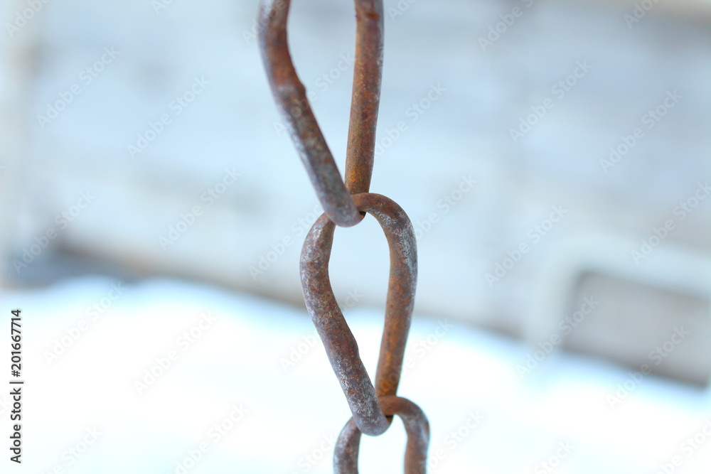 Rusty small metal chain close-up. Background. Rusty small metal chain close-up. Background.