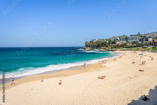 Sunny beautiful summer coast view to Sydney beach and blue Tasman Sea wild wave water and sandy white beaches perfect for surfing swimming hiking  Coogee to Bondi Walk  NSW  Australia - 10 11 2017