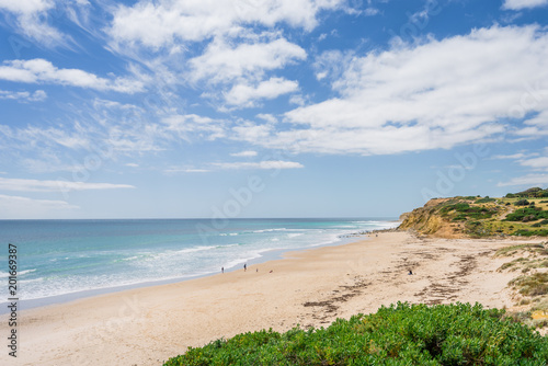 Sunny beautiful summer coast view to the blue sea and pure white sand beach dune limestone sandstone rocks perfect for surfing swimming and hiking  Star of Greece  Port Willunga  Adelaide  Australia