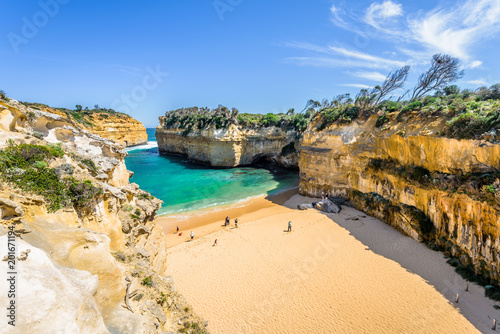 Obraz na płótnie Bright sunny summer coast view to a beautiful sandy beach bay and rocky erosion sand limestone cliff of Great Ocean Road, walking at Loch Ard Gorge, Port Campbell National Park, Victoria/ Australia w salonie