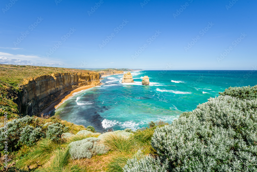 Bright sunny summer coast view to the wild Bass Strait, rocky erosion cliffs of the Great Ocean Road sandstone limestone formation 12 Twelve Apostels, Melbourne, Port Campbell National Park, Australia