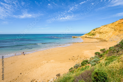 Sunny beautiful summer coast view to blue sea and pure white sand beach dune limestone sandstone rocks perfect for surfing swimming hiking  Great Ocean Road  Torquay  Melbourne  Victoria  Australia