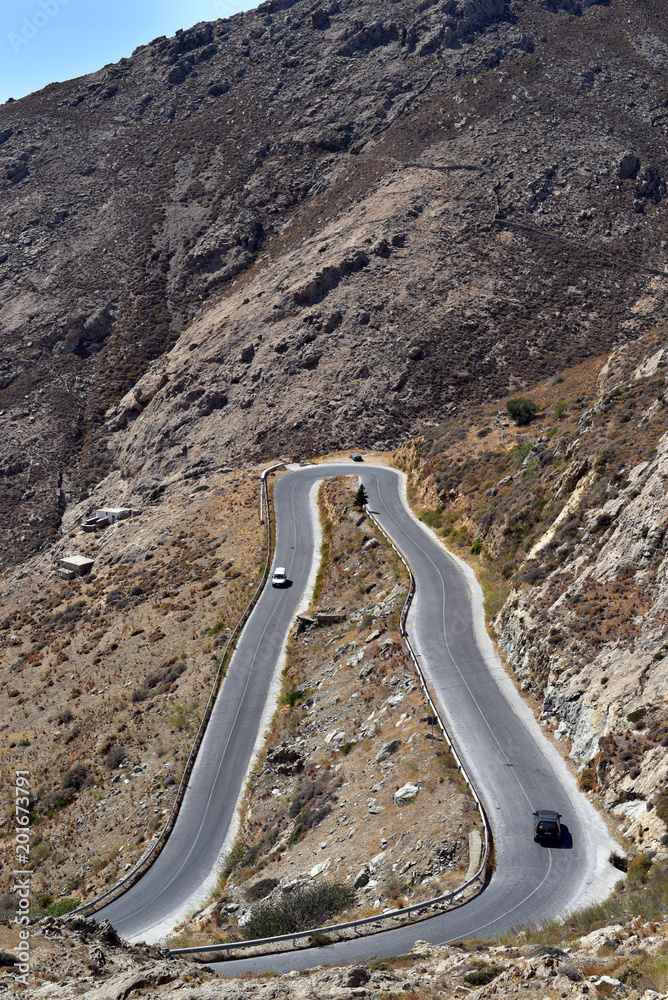 Curved road between Livadi Town abd Chora Village in Serifos Island, Greece