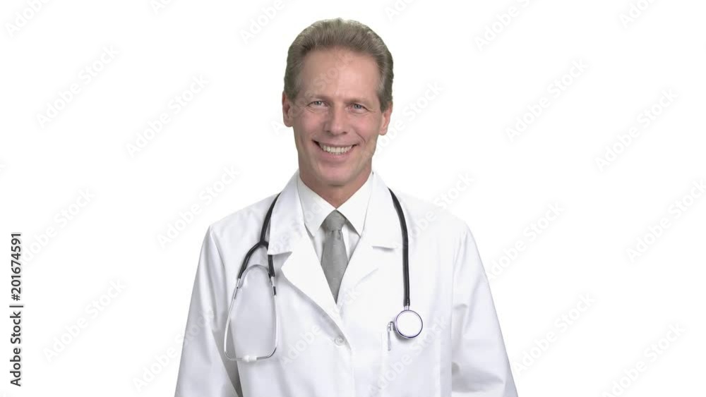 Cheerful mature physician smiling portrait. Handsome smiling male doctor with stethoscope looking at camera, white isolated background. Cheerful mature physician smiling portrait. Handsome smiling male doctor with stethoscope looking at camera, white isolated background.
