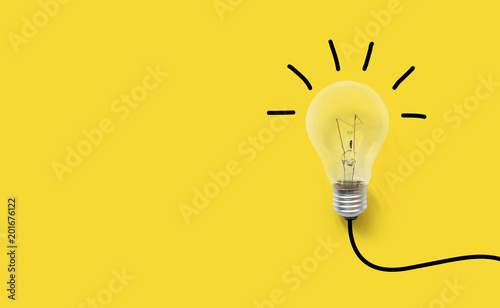 Creative thinking ideas brain innovation concept. Light bulb on yellow background photo