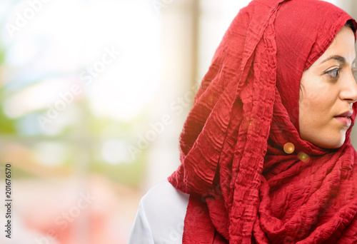 Young arab woman wearing hijab side view portrait