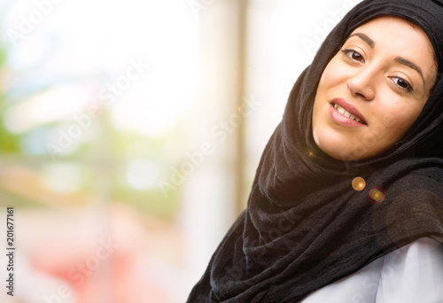 Young arab woman wearing hijab confident and happy with a big natural smile