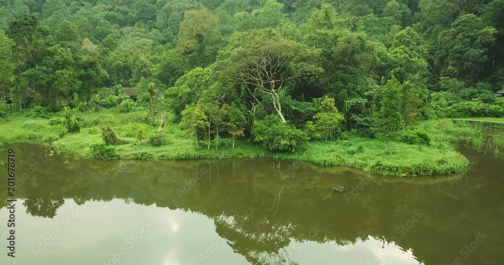 Beautiful aerial panorama of Situ Gunung forest lake with green rainforest background from a drone at Sukabumi, West Java, Indonesia. Shot in 4k resolution Beautiful aerial panorama of Situ Gunung forest lake with green rainforest background from a drone at Sukabumi, West Java, Indonesia. Shot in 4k resolution