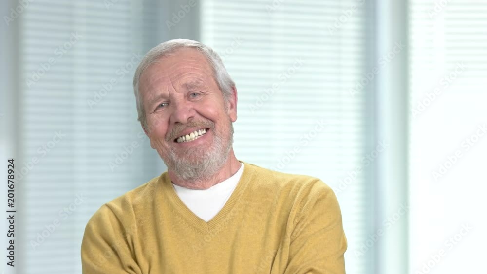 Smiling senior man looking at camera. Portrait of happy older male person. Positive elderly man. People, emotions, expressions. Smiling senior man looking at camera. Portrait of happy older male person. Positive elderly man. People, emotions, expressions.