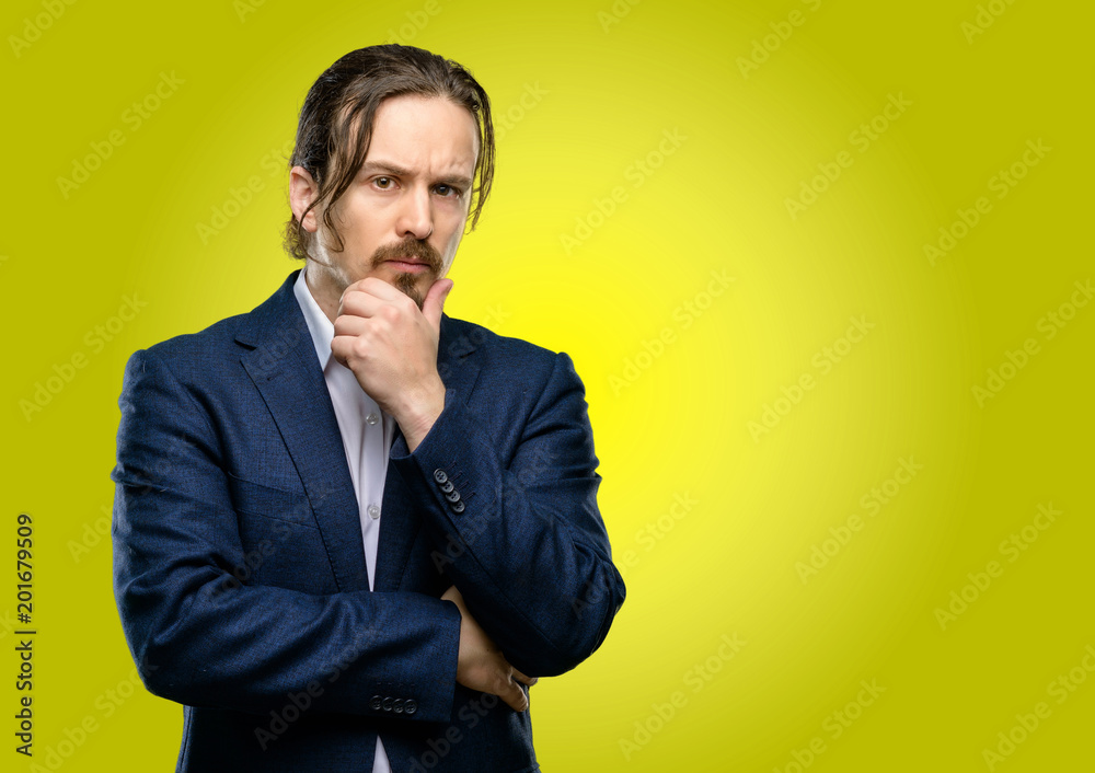Handsome young man thinking thoughtful with smart face Handsome young man thinking thoughtful with smart face