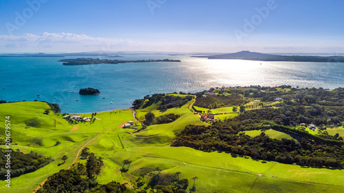 Aerial view on a shore on sunny harbor with small houses. Waiheke Island, Auckland, New Zealand.