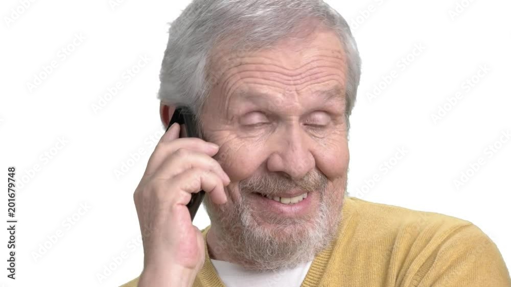 Older guy talking on mobile phone. Happy senior man talking on his cell phone close up, isolated on white background. Older guy talking on mobile phone. Happy senior man talking on his cell phone close up, isolated on white background.