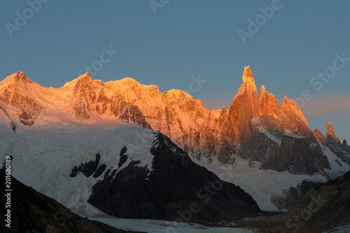 Alpenglow warm morning light touch the Cerro Torre, the mountains in the Southern Patagonian Ice Field in South America.Los Glaciares National Park, El Chalten, Argentina.