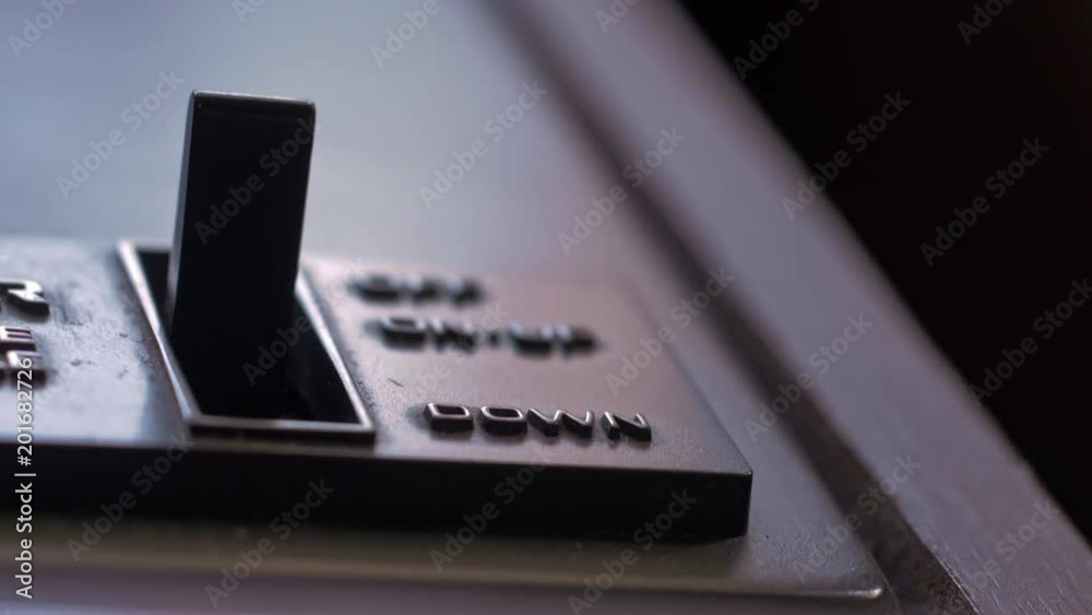 Close up shot of vinyl record turntable tone arm control switch