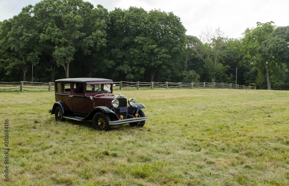 Old vintage car in open field