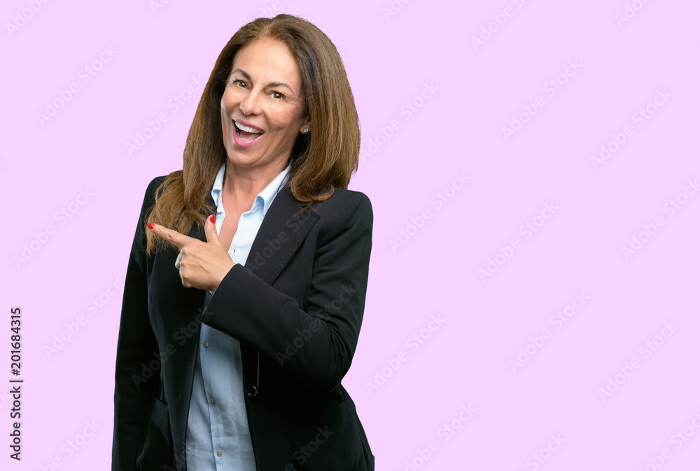 Middle age business woman pointing away side with finger Middle age business woman pointing away side with finger