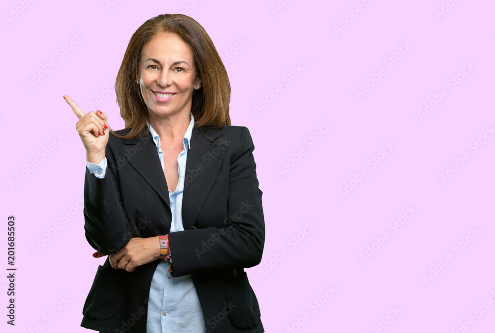 Middle age business woman pointing away side with his finger Middle age business woman pointing away side with his finger