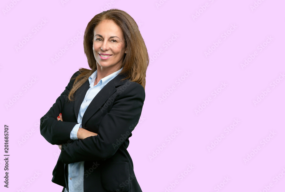 Middle age business woman with crossed arms confident and happy with a big natural smile laughing Middle age business woman with crossed arms confident and happy with a big natural smile laughing