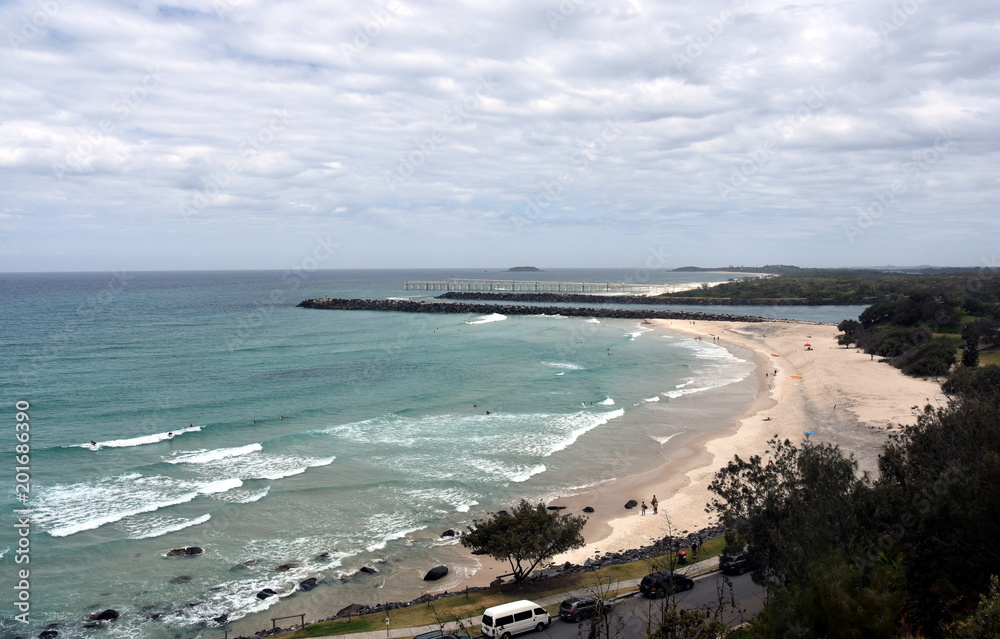 Duranbah beach and breakwall at the entrance of Tweed River on a cloudy day. Duranbah Beach, officially known as Flagstaff beach is the most northern beach in New South Wales.