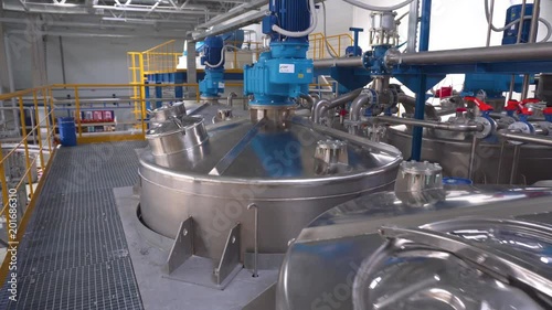Manufacture of paint, paint mixing tanks