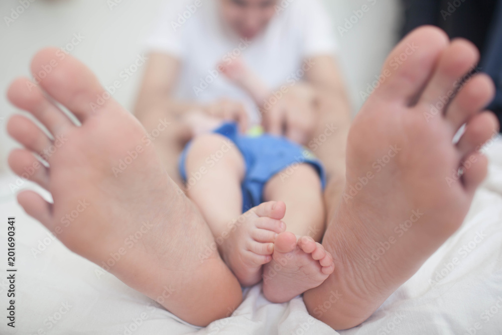 Father and son lying on the bed. Father and son lying on the bed.