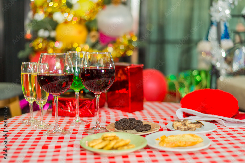 many Glass of wine with cookies in dish on the table, concept of celebration party