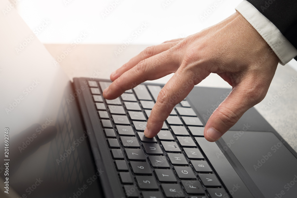 Hands are typing on the computer keyboard. Hands are typing on the computer keyboard.