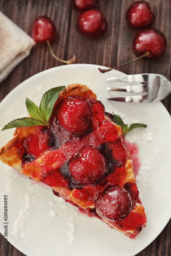 Delicious piece of cherry pie on plate Delicious piece of cherry pie on plate
