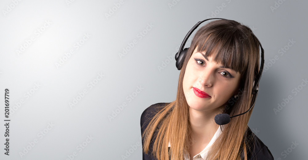 Young female telemarketer on a white background Young female telemarketer on a white background