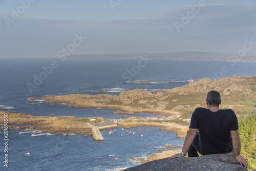 Someone sitting in Camarinas coast (La Coruna, Spain). © josfor