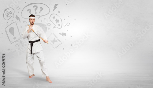 Young kung-fu trainer fighting with doodled symbols concept   © ra2 studio