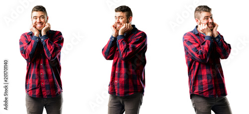 Young man happy and surprised cheering expressing wow gesture isolated over white background, collage composition