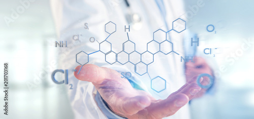 Fototapeta Naklejka Na Ścianę i Meble -  Doctor holding a 3d rendering molecule structure isolated on a background