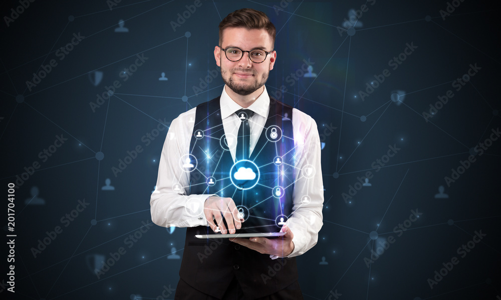 Secured cloud hologram on tablet holded by spectacled young businessman in suit
Secured cloud hologram on tablet holded by spectacled young businessman in suit