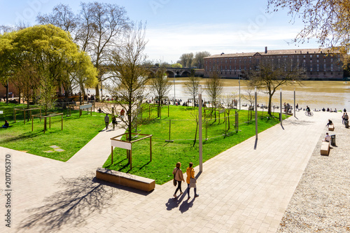Fototapeta Naklejka Na Ścianę i Meble -  People relaxing time at public park in Toulouse, France.
