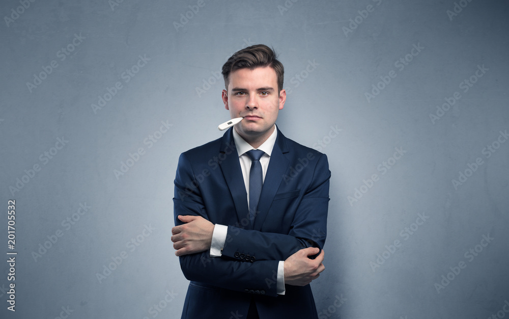 Young tired businessman with thermometer and copy space
Young tired businessman with thermometer and copy space
