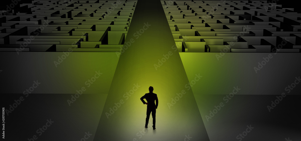 Businessman going straight ahead on a wide road between dark mazes
Businessman going straight ahead on a wide road between dark mazes