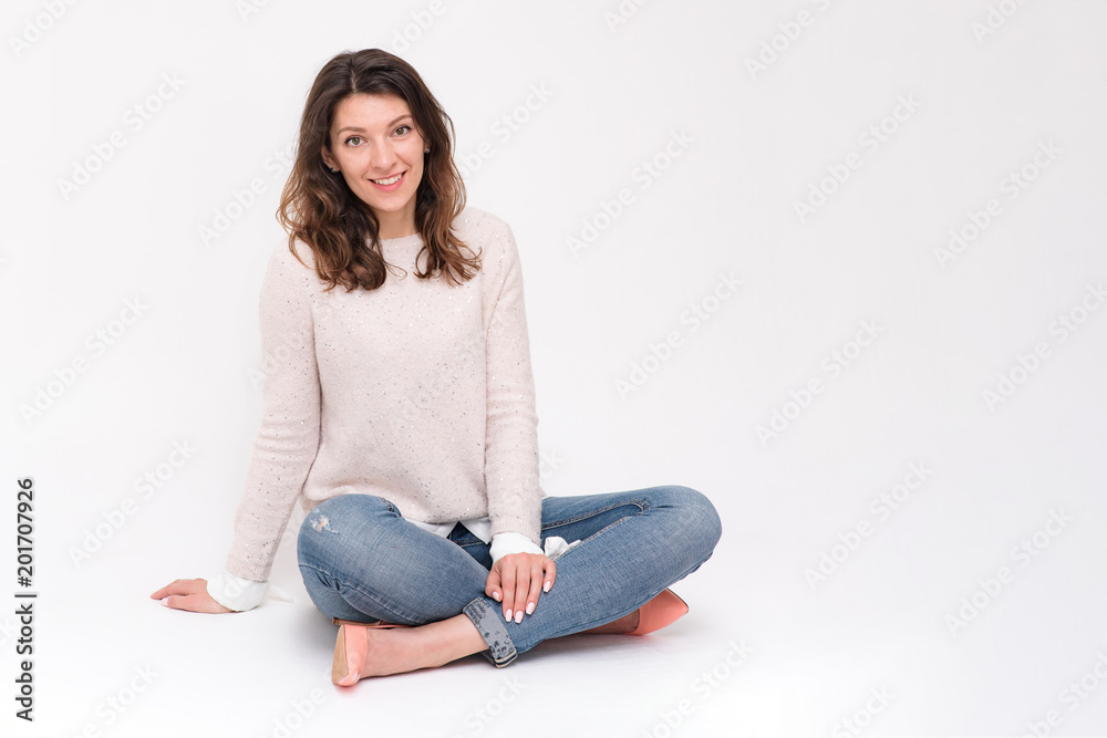 beautiful girl sitting on the floor in different poses